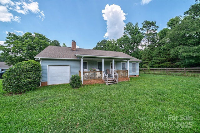 7411 Davis Rd, Waxhaw, NC 28173 - rear view of house with covered porch, a chimney, a garage, and a shingled roof