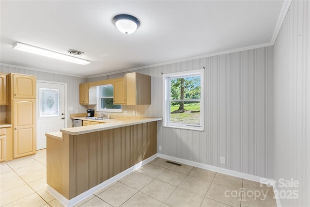 735 Edmiston Rd, Mount Ulla, NC 28125 - kitchen with light brown cabinets, light countertops, crown molding, healthy amount of natural light, and light tile patterned floors