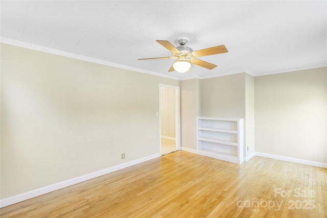 735 Edmiston Rd, Mount Ulla, NC 28125 - unfurnished room featuring crown molding, light wood-style floors, built in features, and a ceiling fan