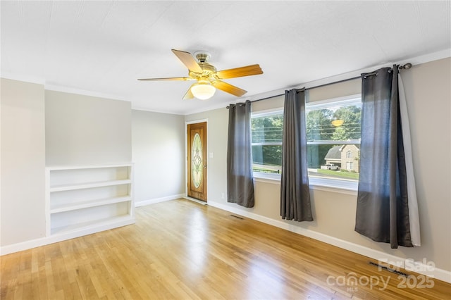 735 Edmiston Rd, Mount Ulla, NC 28125 - unfurnished room featuring wood finished floors, a ceiling fan, and ornamental molding