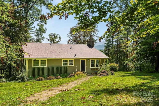 4 Northview Ln, Weaverville, NC 28787 - rear view of property with a chimney, a lawn, and roof with shingles