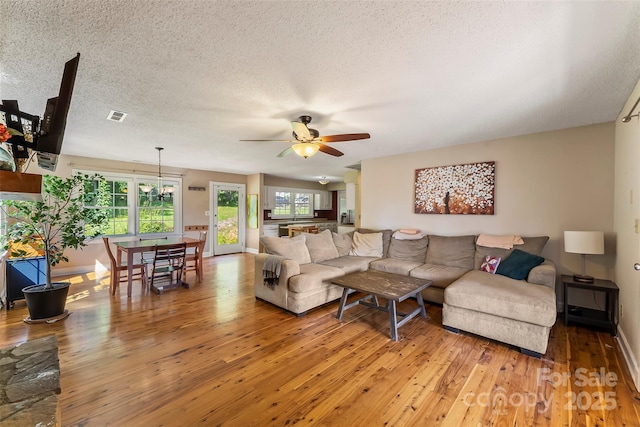 4 Northview Ln, Weaverville, NC 28787 - living area with a ceiling fan, light wood-style floors, and a textured ceiling
