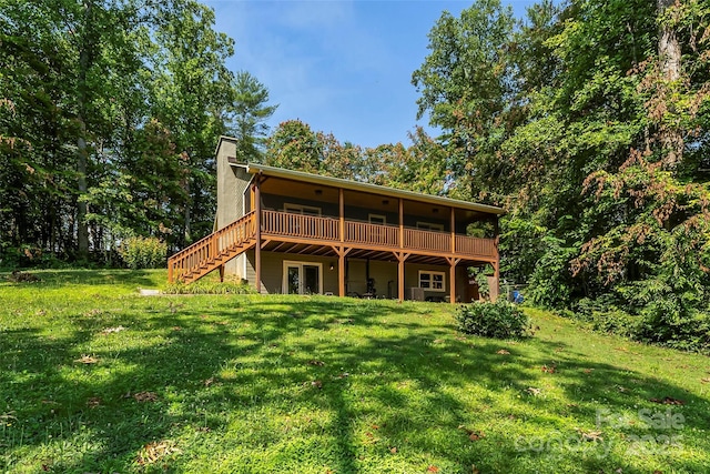 4 Northview Ln, Weaverville, NC 28787 - rear view of house featuring a lawn, a wooden deck, a chimney, and stairs
