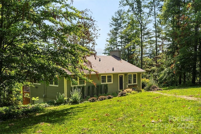 4 Northview Ln, Weaverville, NC 28787 - view of home's exterior featuring a chimney and a yard