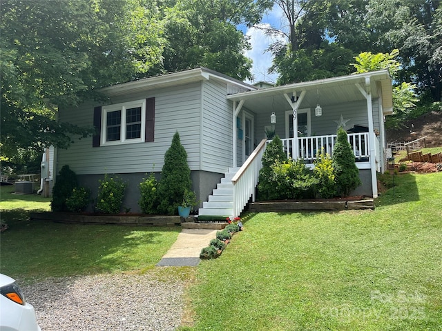 69 Devlin St, Canton, NC 28716 - view of front of house featuring a front yard and a porch