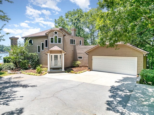 5 Hidden Cove Ln, Clover, SC 29710 - view of front facade with a garage, a chimney, and concrete driveway