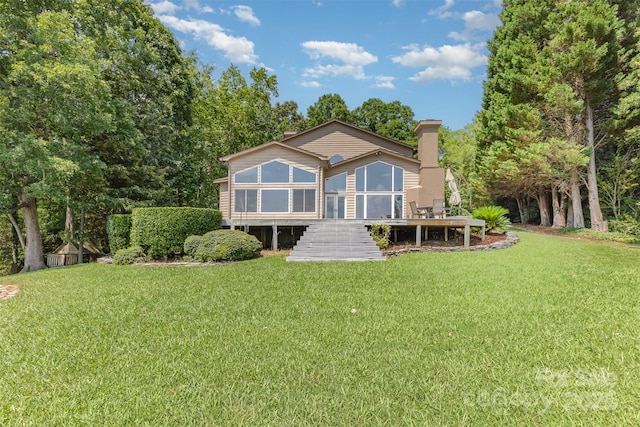 5 Hidden Cove Ln, Clover, SC 29710 - rear view of house featuring a sunroom, stairs, a lawn, and a wooden deck