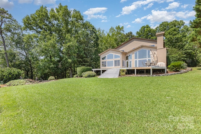 5 Hidden Cove Ln, Clover, SC 29710 - back of house featuring a sunroom, a lawn, and a chimney