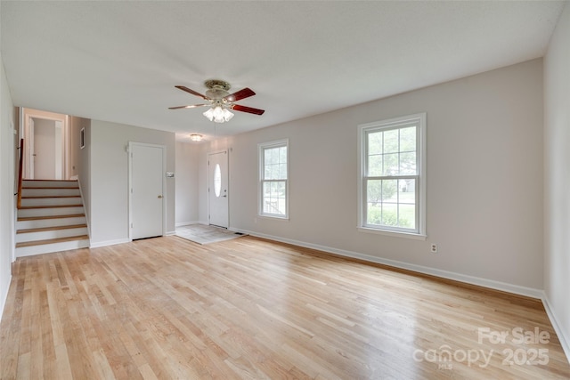 810 Applegate Ct, Gastonia, NC 28054 - unfurnished living room with stairway, light wood-type flooring, and a ceiling fan