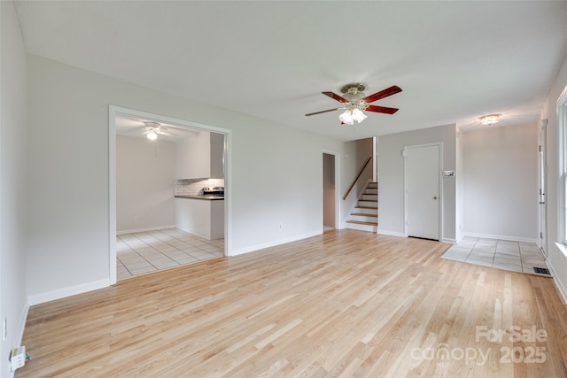 810 Applegate Ct, Gastonia, NC 28054 - unfurnished room with ceiling fan, light wood-style floors, and stairs