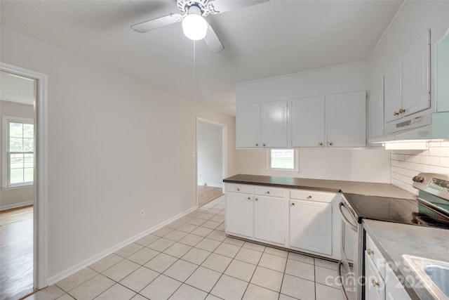 810 Applegate Ct, Gastonia, NC 28054 - kitchen with stainless steel electric range oven, under cabinet range hood, white cabinets, and ceiling fan
