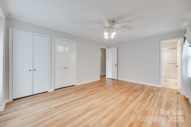 810 Applegate Ct, Gastonia, NC 28054 - unfurnished bedroom featuring multiple closets, light wood finished floors, ensuite bathroom, ornamental molding, and ceiling fan