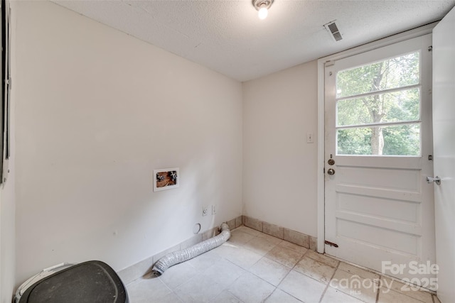 810 Applegate Ct, Gastonia, NC 28054 - laundry area featuring hookup for a washing machine, a textured ceiling, and light tile patterned floors