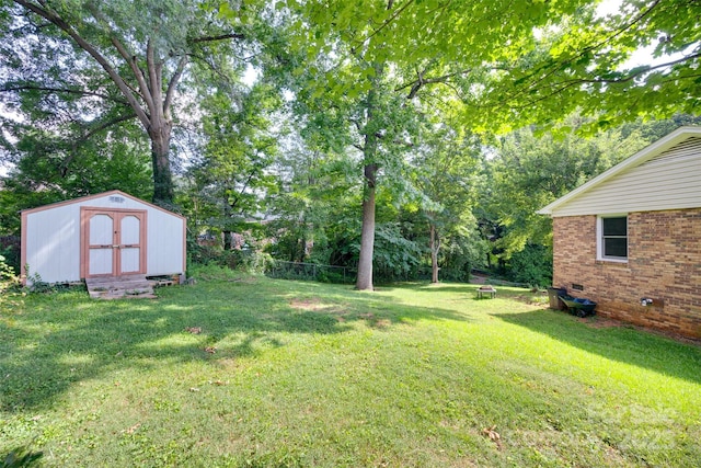 810 Applegate Ct, Gastonia, NC 28054 - view of grassy yard featuring a storage shed and view of scattered trees