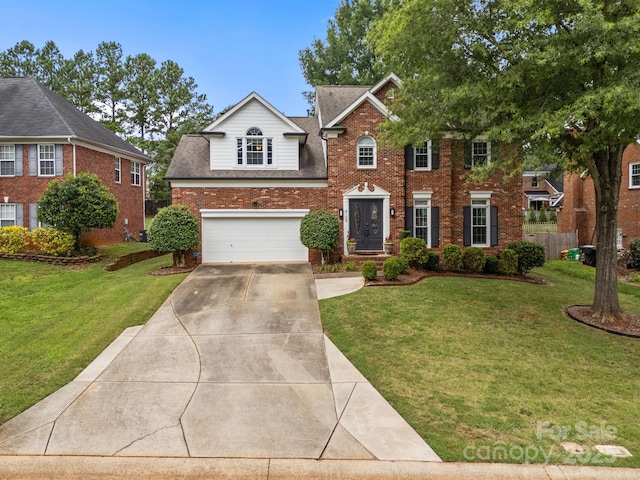 4108 Deerfield Dr NW, Concord, NC 28027 - view of front of home with concrete driveway, brick siding, a garage, and a front yard
