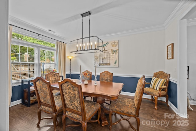 4108 Deerfield Dr NW, Concord, NC 28027 - dining space featuring wood finished floors, a chandelier, and crown molding