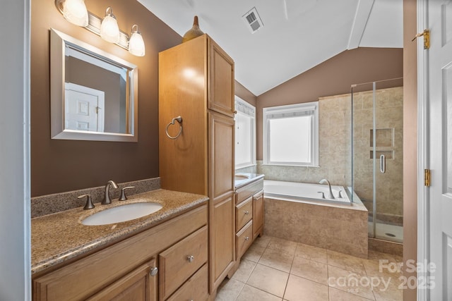 4108 Deerfield Dr NW, Concord, NC 28027 - bathroom with vanity, a garden tub, tile patterned floors, a shower stall, and vaulted ceiling