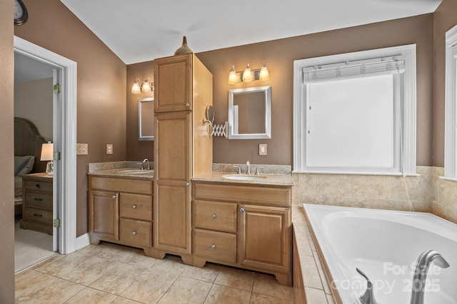 4108 Deerfield Dr NW, Concord, NC 28027 - bathroom with lofted ceiling, double vanity, a garden tub, and tile patterned floors