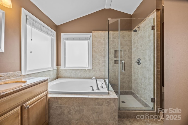 4108 Deerfield Dr NW, Concord, NC 28027 - bathroom featuring a garden tub, vanity, a stall shower, and vaulted ceiling