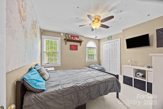 4108 Deerfield Dr NW, Concord, NC 28027 - carpeted bedroom with multiple windows, a closet, and ceiling fan