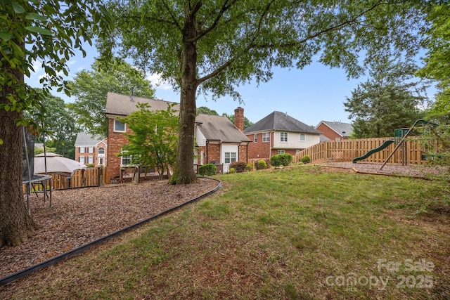 4108 Deerfield Dr NW, Concord, NC 28027 - fenced yard with a playground and a trampoline