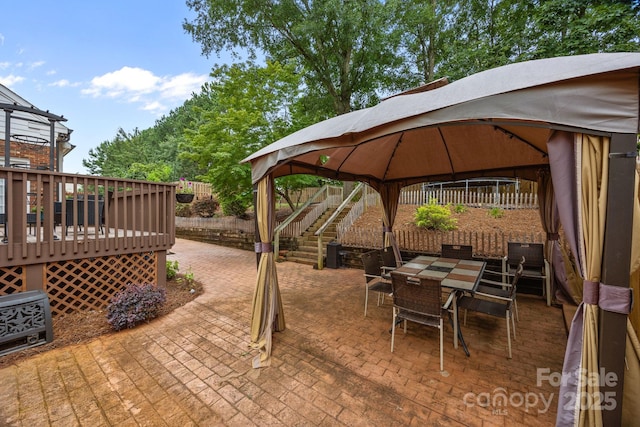 4108 Deerfield Dr NW, Concord, NC 28027 - view of patio / terrace with a gazebo, a wooden deck, and outdoor dining area