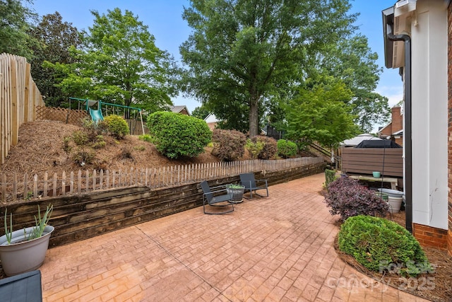 4108 Deerfield Dr NW, Concord, NC 28027 - fenced backyard featuring a patio and a playground