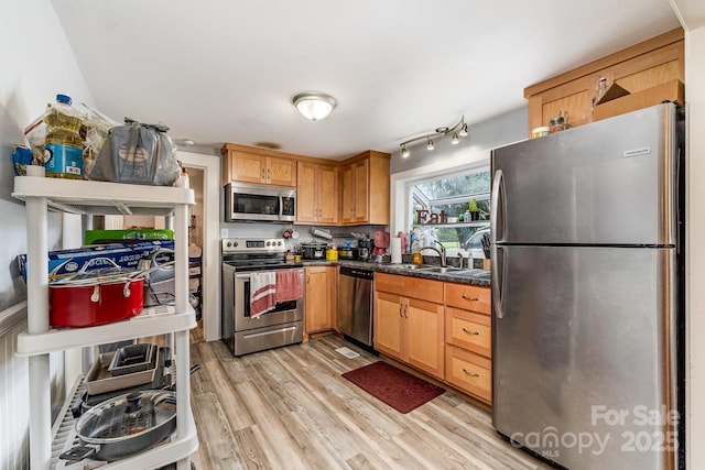 60 37th St NW, Hickory, NC 28601 - kitchen with stainless steel appliances, light wood-style flooring, and dark countertops