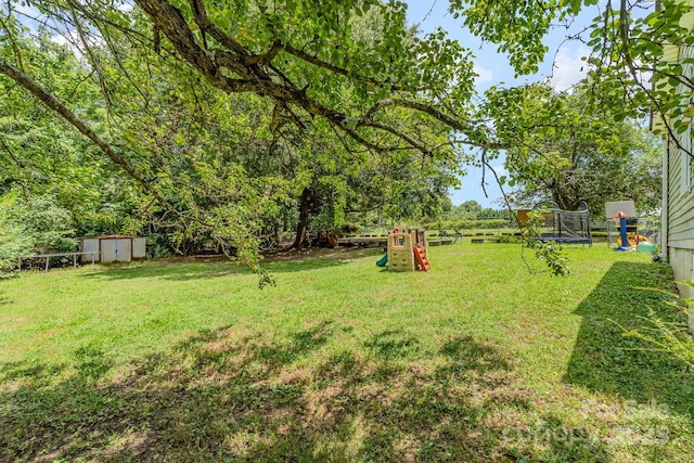 60 37th St NW, Hickory, NC 28601 - view of yard with a trampoline and a storage shed