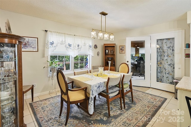 209 Camellia Way, Hendersonville, NC 28739 - dining area featuring light tile patterned floors and a textured ceiling