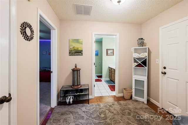 209 Camellia Way, Hendersonville, NC 28739 - hallway featuring a textured ceiling and baseboards