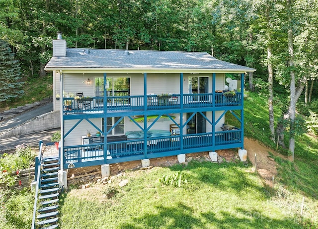 208 Tuckaway Rd, Waynesville, NC 28785 - view of front of house featuring a chimney, a shingled roof, a balcony, stairs, and a view of trees