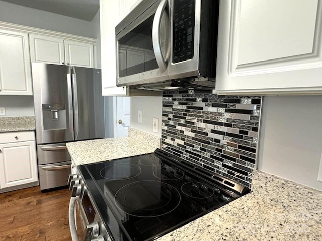 7563 Sedgebrook Dr W, Stanley, NC 28164 - kitchen with stainless steel appliances, backsplash, white cabinets, and light stone counters