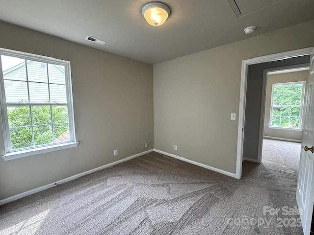 7563 Sedgebrook Dr W, Stanley, NC 28164 - carpeted spare room featuring a smoke detector and attic access