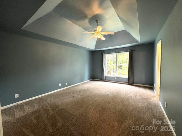 7563 Sedgebrook Dr W, Stanley, NC 28164 - carpeted empty room with a tray ceiling and ceiling fan