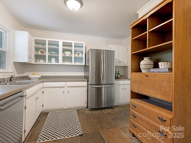 5123 Glenham Dr, Charlotte, NC 28210 - kitchen with appliances with stainless steel finishes, open shelves, white cabinetry, glass insert cabinets, and light countertops