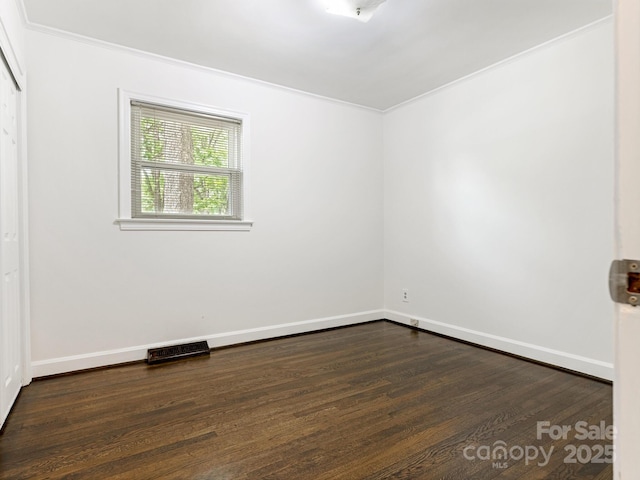 5123 Glenham Dr, Charlotte, NC 28210 - empty room with dark wood-style flooring and ornamental molding