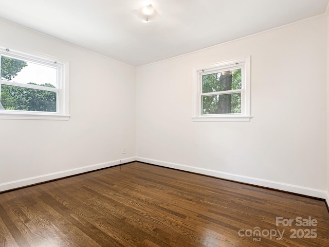5123 Glenham Dr, Charlotte, NC 28210 - spare room featuring dark wood-style floors and crown molding