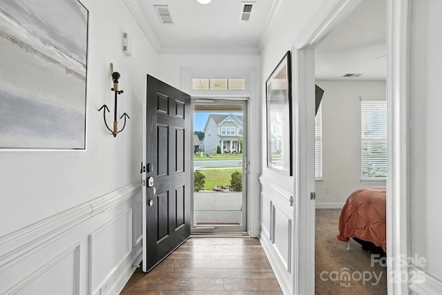 2026 Union Grove Ln, Indian Trail, NC 28079 - entrance foyer featuring ornamental molding, dark wood-style floors, and wainscoting