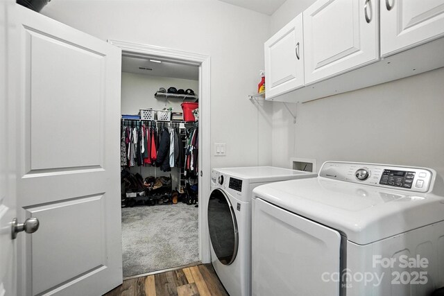 2026 Union Grove Ln, Indian Trail, NC 28079 - laundry area with independent washer and dryer, cabinet space, and dark wood-type flooring