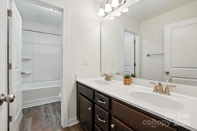 2026 Union Grove Ln, Indian Trail, NC 28079 - bathroom with double vanity, wood finished floors, and bathtub / shower combination