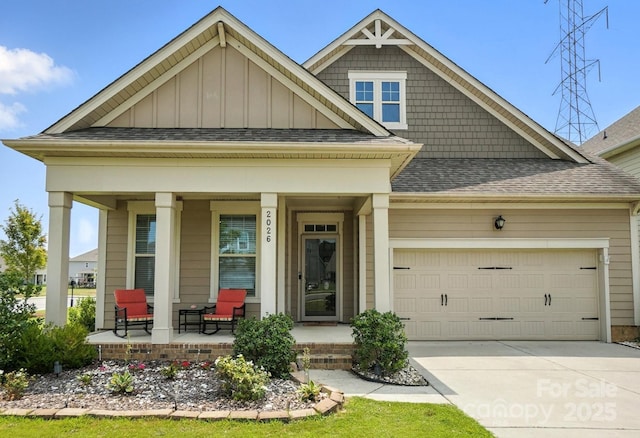 2026 Union Grove Ln, Indian Trail, NC 28079 - view of front of house featuring a porch, a garage, board and batten siding, driveway, and roof with shingles