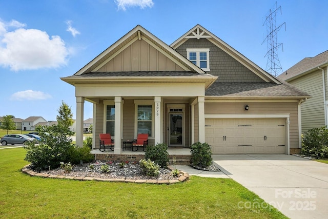 2026 Union Grove Ln, Indian Trail, NC 28079 - craftsman-style home featuring covered porch, an attached garage, a front lawn, driveway, and board and batten siding