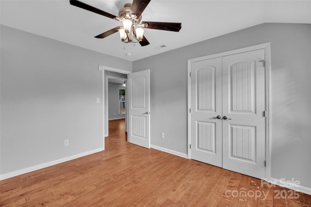 1940 Tyvola Rd, Charlotte, NC 28210 - unfurnished bedroom featuring light wood-style floors, a closet, and a ceiling fan