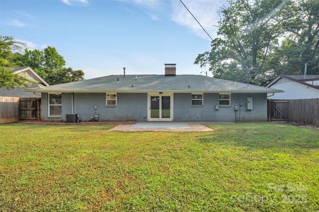 1940 Tyvola Rd, Charlotte, NC 28210 - rear view of property with a patio, a fenced backyard, and brick siding