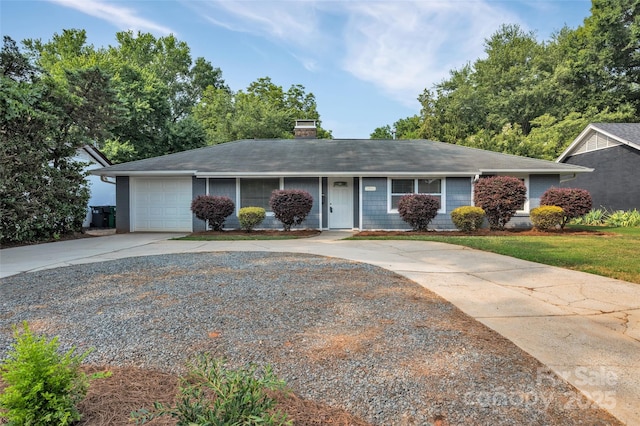 1940 Tyvola Rd, Charlotte, NC 28210 - ranch-style house with concrete driveway, an attached garage, a chimney, and a shingled roof