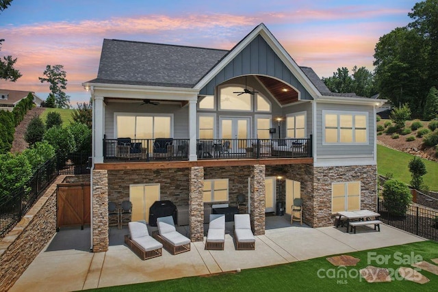 347 Landing Trl, Mount Gilead, NC 27306 - back of house featuring a ceiling fan, a patio, board and batten siding, and stone siding