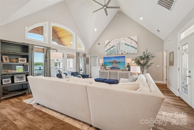 347 Landing Trl, Mount Gilead, NC 27306 - living area featuring high vaulted ceiling, wood finished floors, ceiling fan, french doors, and recessed lighting