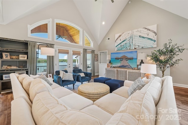 347 Landing Trl, Mount Gilead, NC 27306 - living room featuring wood finished floors, french doors, healthy amount of natural light, ceiling fan, and high vaulted ceiling