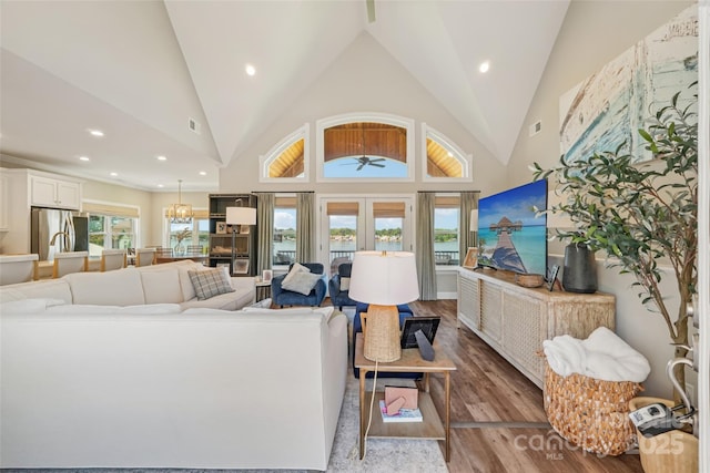 347 Landing Trl, Mount Gilead, NC 27306 - living area with wood finished floors, recessed lighting, ceiling fan, a chandelier, and high vaulted ceiling